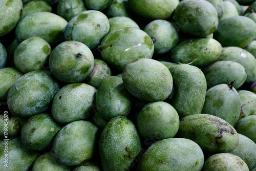 Close-up of Green Mangoes at a Local Fruit Market in Indonesia 