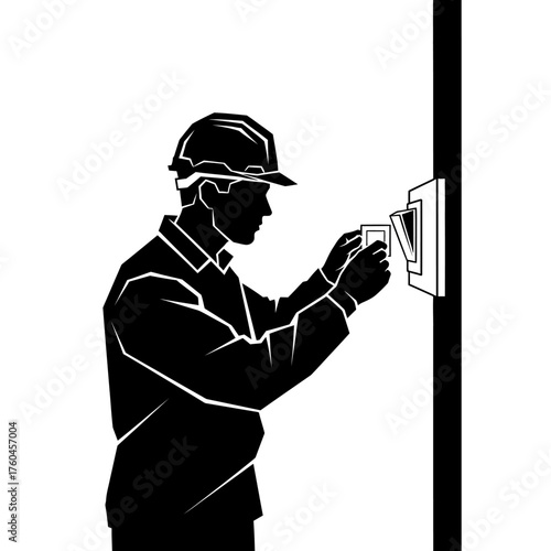 An electrician wearing a safety helmet installs a light switch on a wall, demonstrating electrical work and professional expertise.