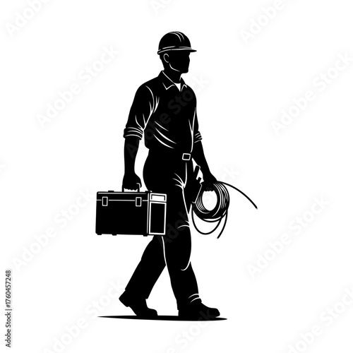 A silhouette of a construction worker in a hard hat carries tools and cable, walking towards a project site, ready to work.