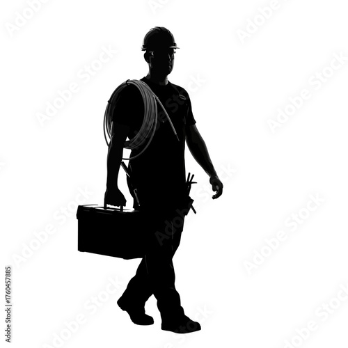 Silhouette of a construction worker walking with tools and equipment, representing labor, trades, and the building industry, in a black and white image.