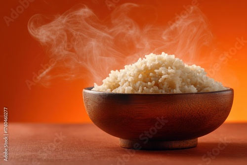 Steaming Rice in Wooden Bowl: A close-up shot of a steaming bowl of fluffy white rice, capturing the essence of a comforting meal. The steam rises gently.