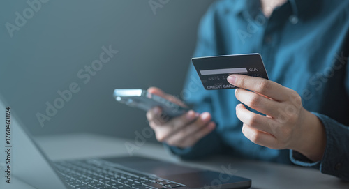 wallet, top up, funds, card, credit, balance, A person holding a credit card and smartphone while adding funds to an online wallet, representing digital finance, fintech, and cashless payment.