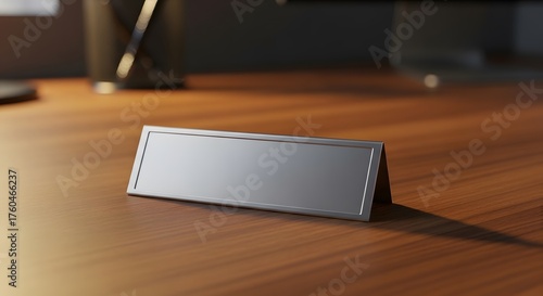 Modern blank desk name plate on a wooden office desk