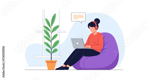 Young woman working on a laptop while sitting on a beanbag chair in a cozy room.