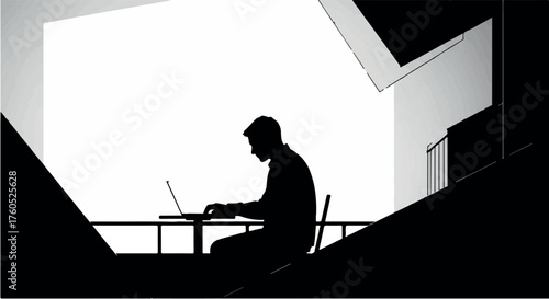 Silhouette of a focused person working on a laptop in a modern, minimalist setting.
