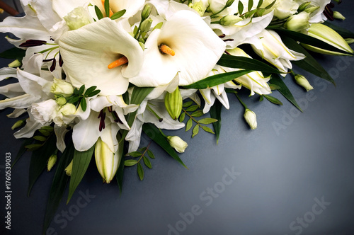 White delicate calla lily flowers composition, condolence flower background card, funeral concept image, selective focus, shallow DOF