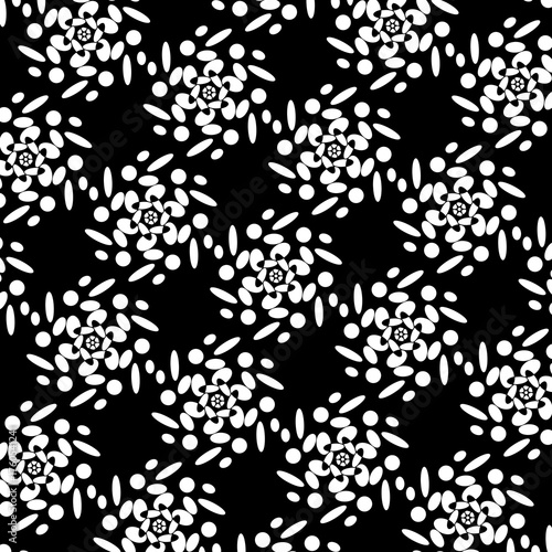 Black and white abstract floral spiral pattern.
