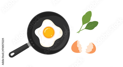 A fried egg cooking in a black pan with spinach leaves and a cracked eggshell.