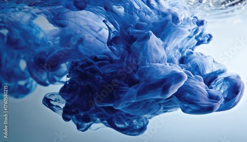 Deep blue ink swirling in water