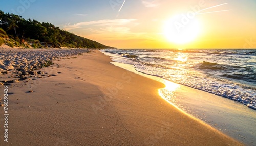Fototapeta Naklejka Na Ścianę i Meble -  Golden Hour at the Baltic Sea - A Serene Beach Sunset.