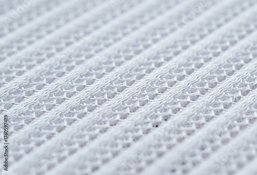 Close-up sample fabric. White mesh texture. Soft and breathable used for industrial work.