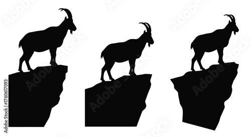 Three mountain goats silhouetted against a white background standing vigilantly
