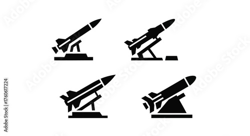 Simple black silhouettes of missiles on launch platforms displayed in a grid