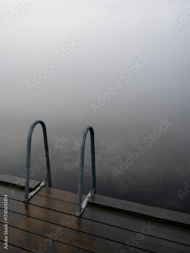 Bathing ladder a misty gray day in Karlskoga Sweden