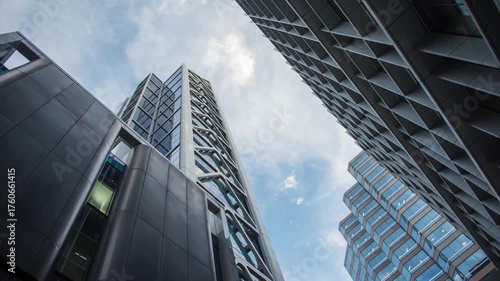 Cloud timelapse with high rise city buildings, time passing city life urban jungle corporate life