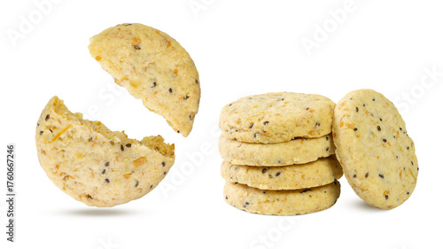 A close-up of golden shortbread cookies, studded with sesame seeds. One cookie is broken open, revealing its crumbly texture.