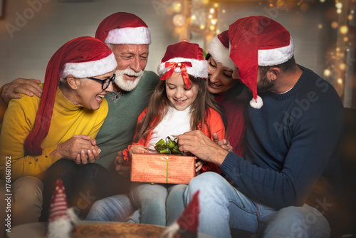 Family on the living room exchanging Christmas presents