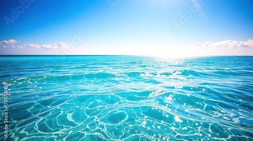 Fototapeta Naklejka Na Ścianę i Meble -  Bright sunny day over the turquoise ocean water with sun reflection