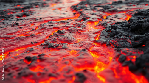 Close up of Molten Lava Flow with Glowing Orange Magma Ripples on Dark Volcanic Rock Surface