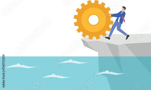 A businessman holds back a large gear rolling down a cliff,
