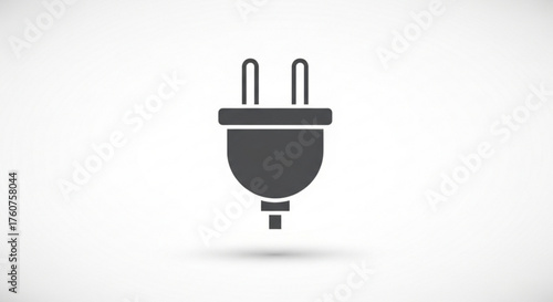 A simple gray power plug icon, representing electricity, connection, and energy in a minimalist design