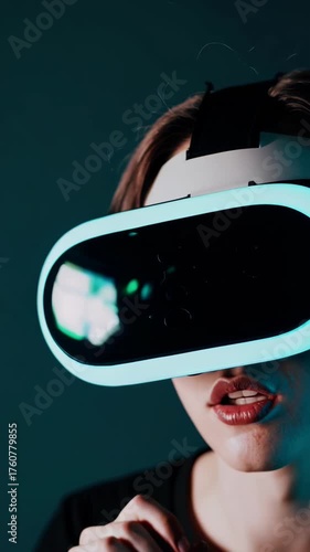 A woman wearing a VR headset is immersed in a virtual world, her expression one of wonder and excitement