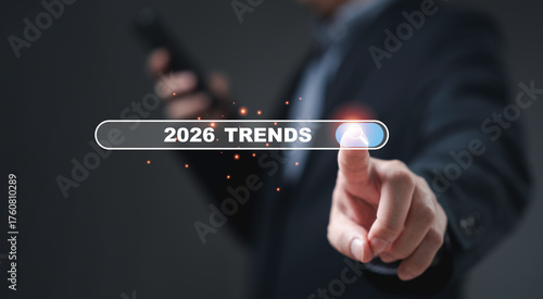 Businessman touching virtual search bar showing 2026 trends concept symbol of future business direction technology innovation and digital transformation for growth strategy and success vision