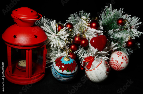 Collection of Christmas decorations arranged on a dark background. Festive ornaments and seasonal elements symbolizing the joyful spirit of the holiday season