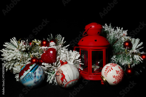 Collection of Christmas decorations arranged on a dark background. Festive ornaments and seasonal elements symbolizing the joyful spirit of the holiday season