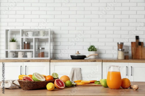Tasty citrus fruits and jug...