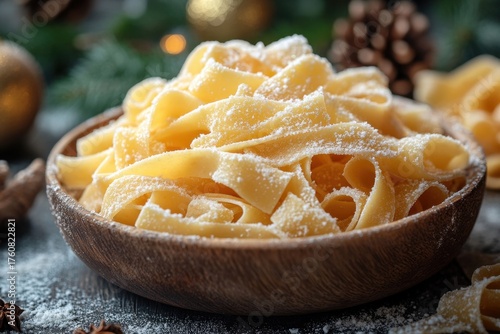 Bowl of pasta, sprinkled with powdered sugar.