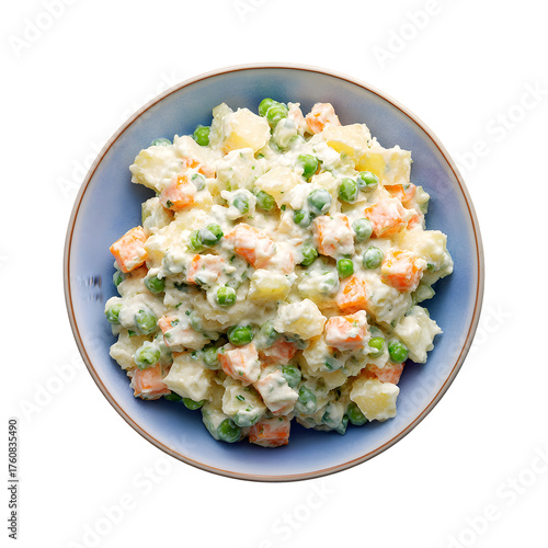 Traditional Russian Olivier salad with potato, carrot, and peas in a bowl. Delicious appetizer isolated on black background, top view.