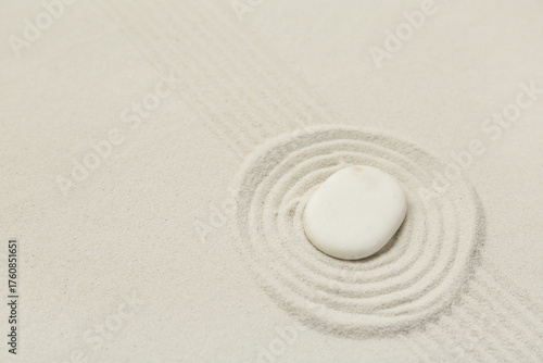 Spa stone on light sand as ...