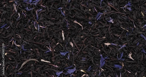 360 Rotative Top view footage of dried Earl Grey Black tea, White tea tips, white jasmine petals with blue cornflower petals
