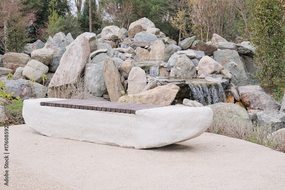 Fototapeta premium modern stone and wood bench in a japanese style garden