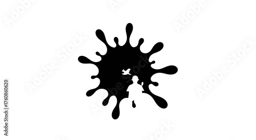 Painterly silhouette: Black ink splash concealing a painter and a soaring bird figure