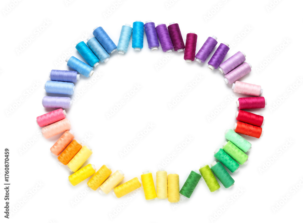 Obraz premium Frame made of thread spools on white background
