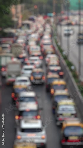 Bokeh view of road traffic near Chhatrapati Shivaji Maharaj Terminus (CSMT railway station) Mumbai, India. Blurred background footage.