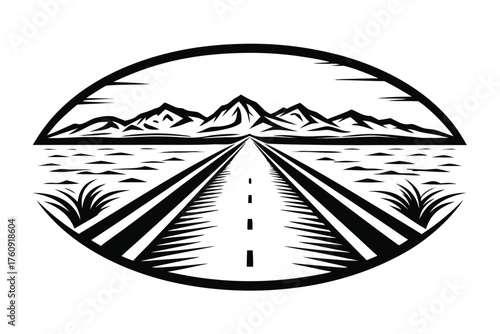Black and white scenic shows road leading toward mountains framed within a circle