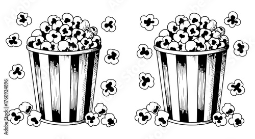 Classic popcorn buckets with scattered popcorn for cinema or movie night