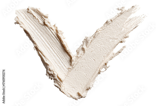 Light beige cosmetic cream in a V-shape, textured