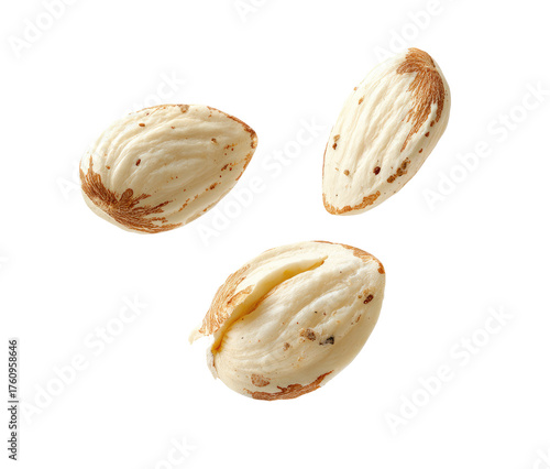 Three whole almonds, light cream color, speckled with brown