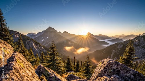 Sunrise Over Mountain Peaks with Foggy Valley and Evergreen Trees