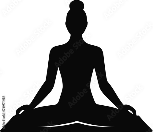 Silhouette of a woman meditating in a yoga lotus pose symbolizing peace relaxation and spiritual wellness