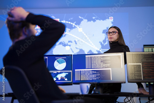 Cybersecurity analysts monitoring threats in a security operations center environment