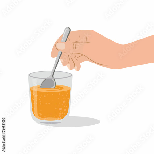 Stirring a fizzy orange drink with a spoon in a glass against a white background illustrating beverage preparation and refreshment
