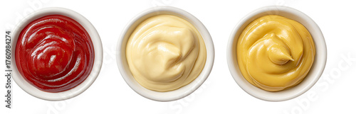 Three small white bowls filled with different sauces