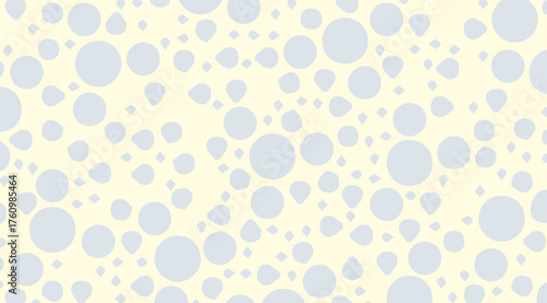 Pale yellow background features a seamless pattern of varied light blue circles, teardrop shapes, and diamond elements, creating a soft, abstract, and contemporary design.