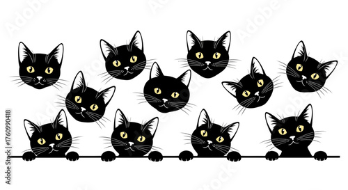 A group of cute black cats with bright yellow eyes are peering over a horizontal ledge in a.