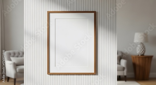 Minimalist Interior Scene Featuring a Blank Wooden Framed Poster Hanging on a Textured Wall with Soft Natural Light Illuminating the Space and Furniture